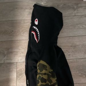 Black and camouflage bathing ape full-zip hoodie.